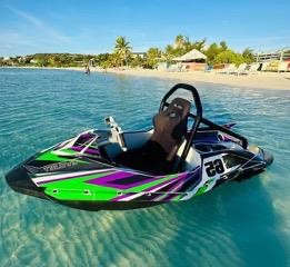 Jet ski gliding across clear turquoise water